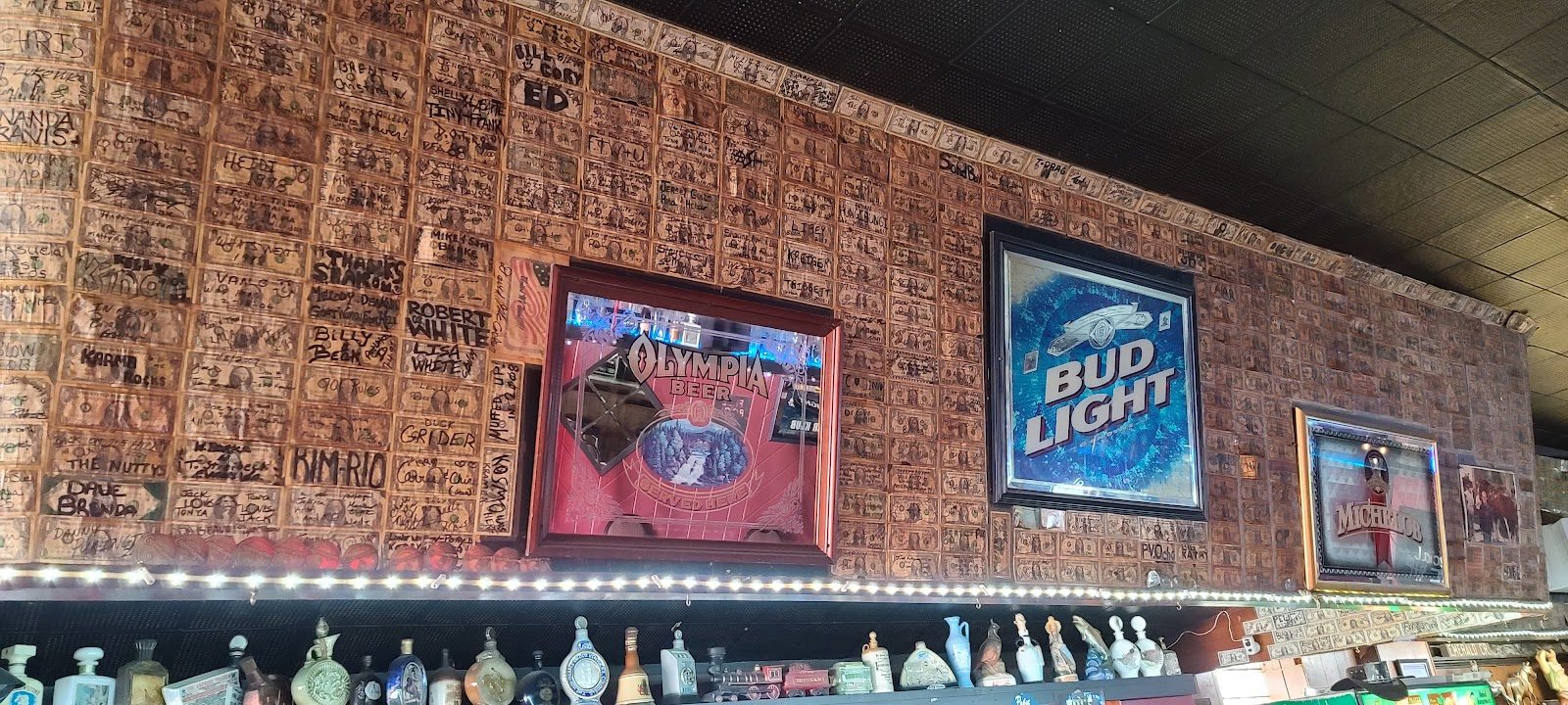 Wall of signed dollar bills above the bar