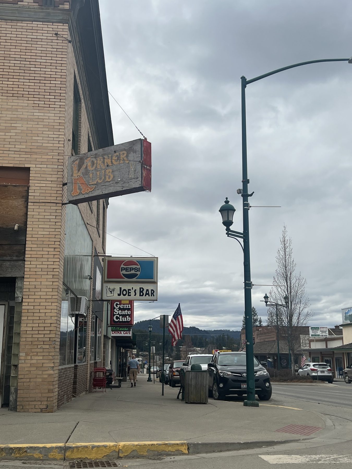 Korner Klub sign over the sidewalk on Main Ave